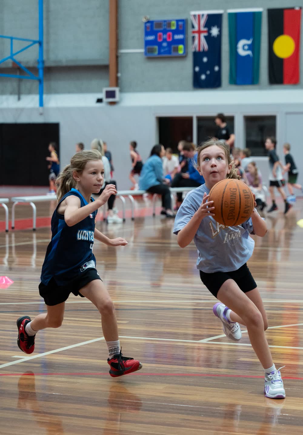 Two young players competing for the ball at an Early Edge session