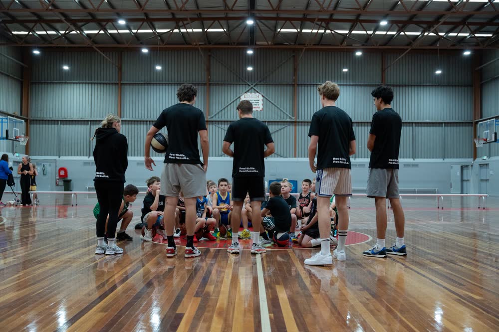 Coaches on court at the Pro Precision training facility