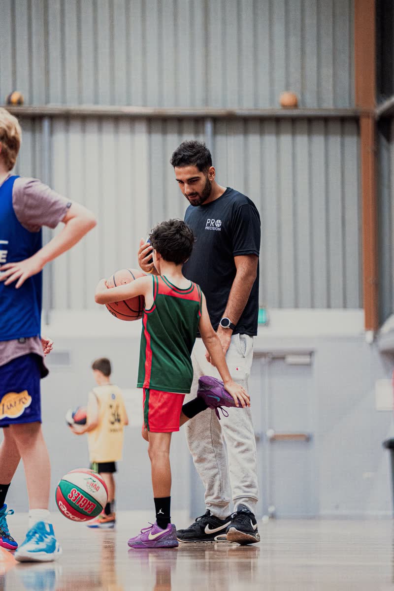 Coach working with a player during a small group session