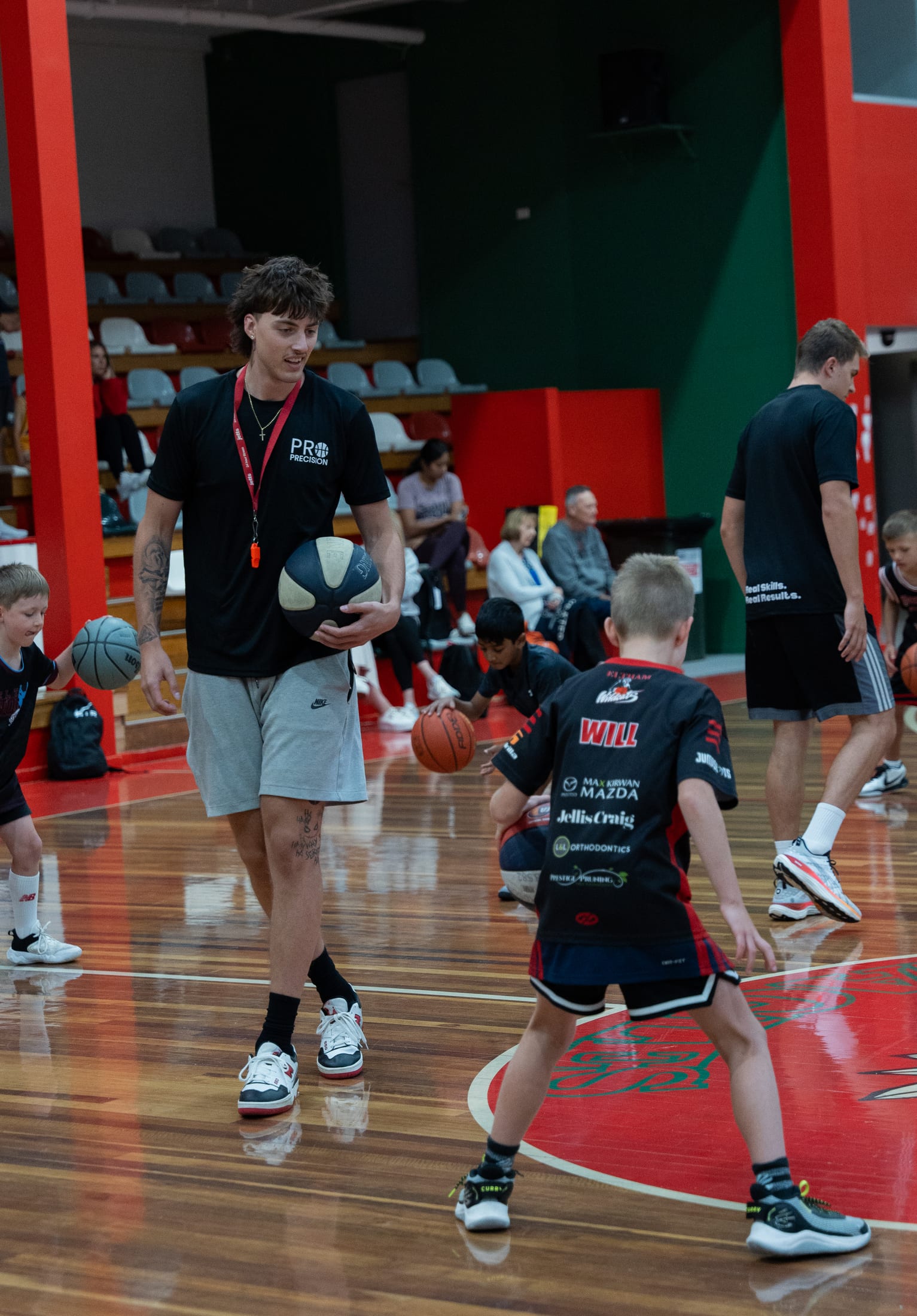 Coach giving feedback courtside