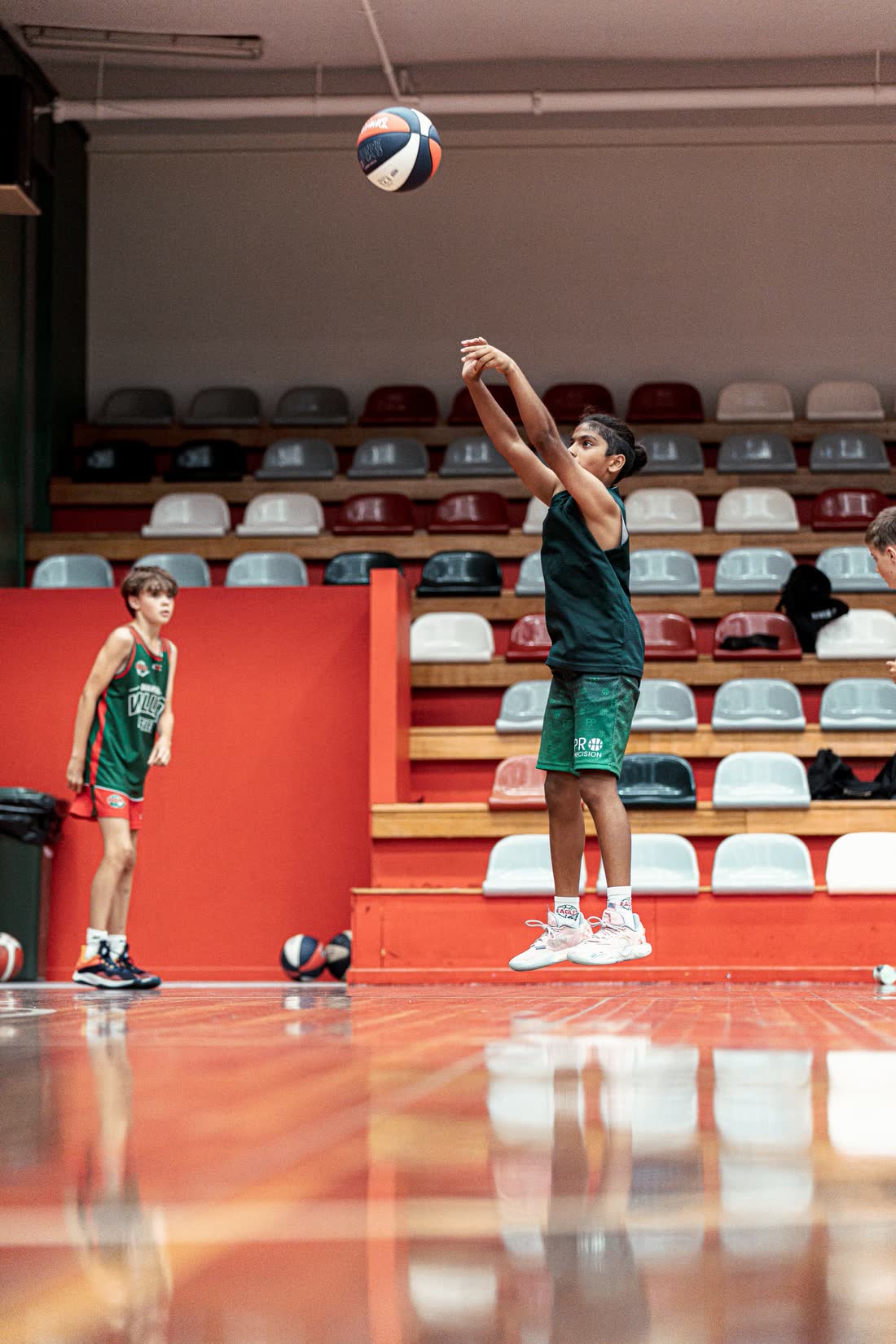Player following through on a jump shot